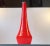 Reminiscent of the designs by Gino Vistosi, this tall organically shaped pendant lamp is made of cased orange glass....
