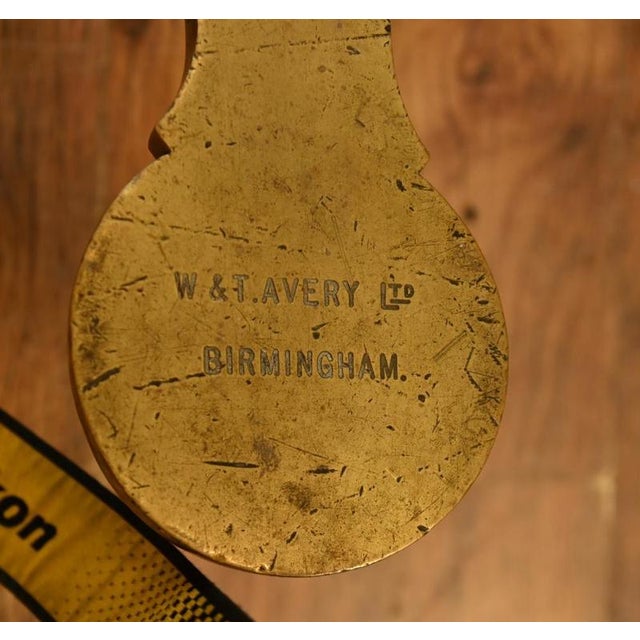 An impressive antique brass balance scale manufactured by the celebrated firm w. & t. Avery of birmingham, dating to...