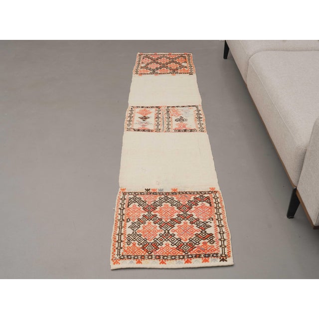Vintage Hand-Knotted runner rug is a semi-antique vintage area rug. The '70s Eastern region of Anatolia's unique rug is...
