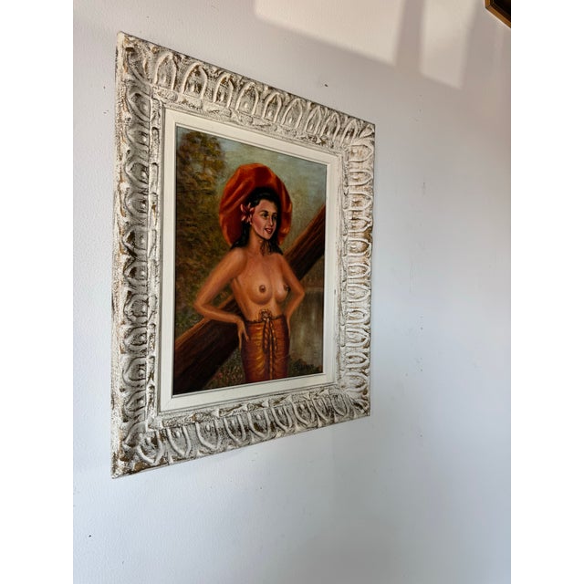 Available for sale this captivating 1950s vintage oil on board painting by Sylvia, depicting a nude woman adorned with a...