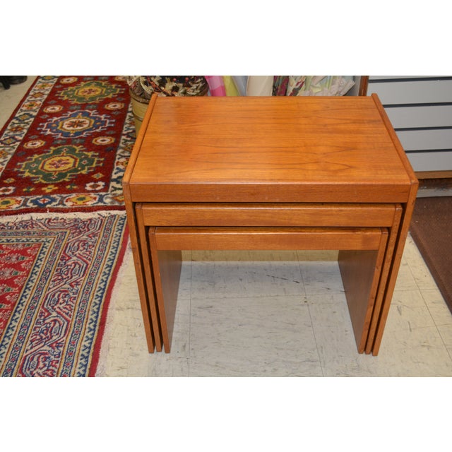 This is a nice looking set of 3 nesting teak tables from Denmark. Overall nice condition, gently used. Size listed in...