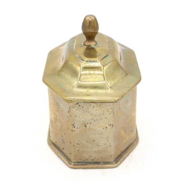 Mid-late 18th century cast brass tobacco box, English. Eight sides with conforming cover with bell metal finial. 5 1/8" x...
