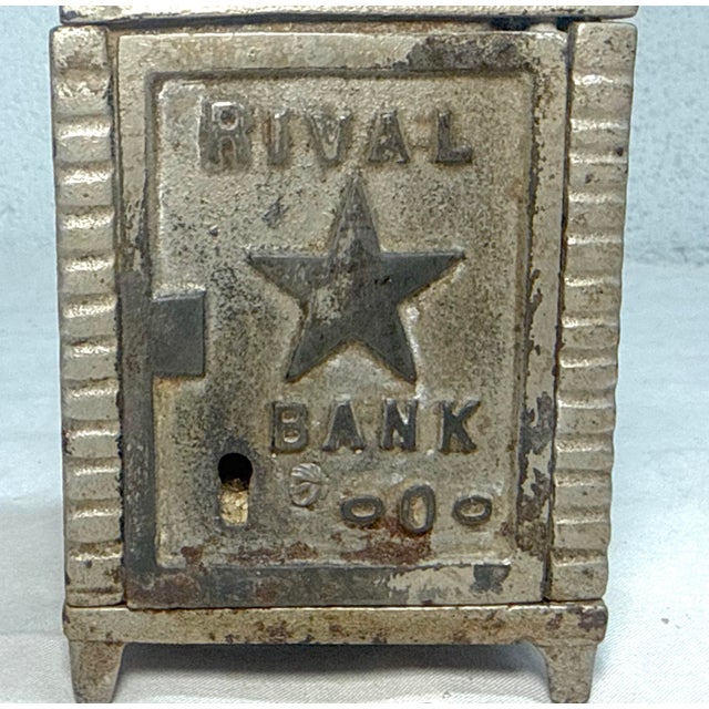 Up for sale is a wonderful antique early 20th century cast Iron Rival safe still bank. It is a unique and collectible...