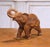 This charming mid-century Italian ceramic elephant sculpture, crafted circa 1950–1960, features a lively depiction of the...