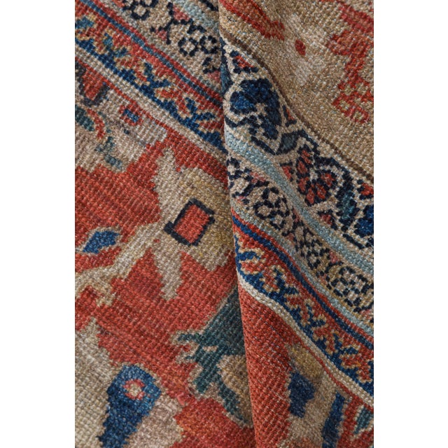 A late 19th century Persian antique sultanabad rug, the reddish orange field with an allover lattice of beige leafy vines,...