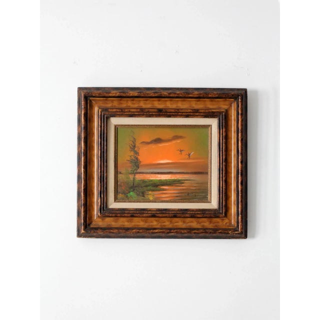 A serene vintage oil painting on canvas, signed by the artist Bailey, depicting a pair of mallard ducks in flight over a...