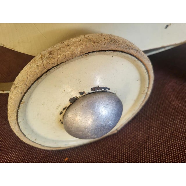 Pre-war wooden doll's carriage, dimensions height to handle 54.5 cm. height without handle 36 cm. width 27.5 cm. depth...