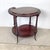 The kidney form has a long history in English furniture, and this antique mahogany two-tier example carries that tradition...