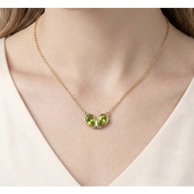 Celebrate timeless elegance with this beautifully crafted double pear gemstone necklace, designed to symbolize connection,...