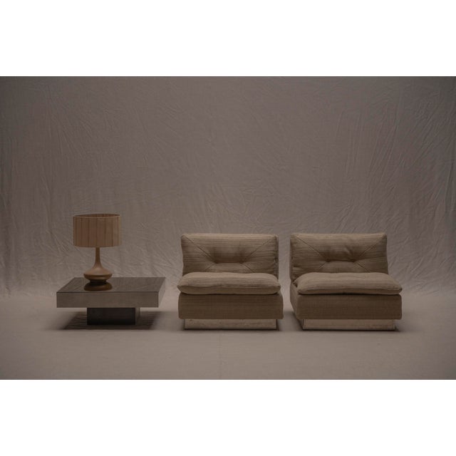 A stunning and elegant pair of Space Age easy chairs produced by Saporiti Italia circa the 1970s. These exceptionally...