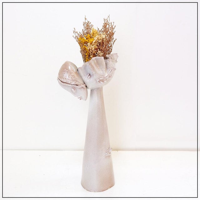 Ceramic Decoration - Art - Vase Measures : 20x14cm H:35cm This ceramic vase features a contemporary design characterized...