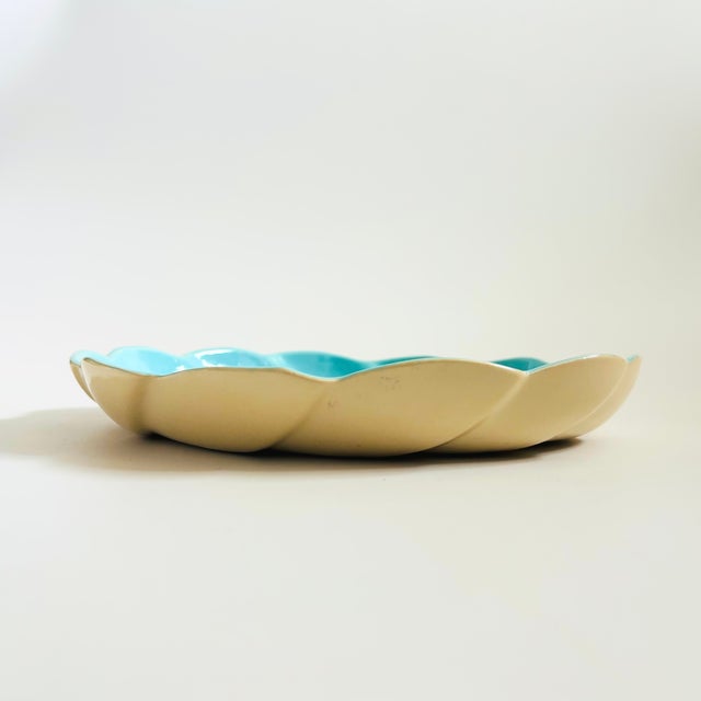 A mid century California art pottery tray. Nice large size for a variety of serving needs. Features a swirl design wiith a...