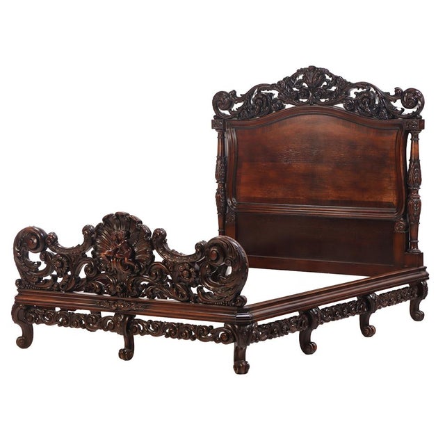 This intricately carved marriage bed depicting two lovers carved into the footboard features an optional matching canopy....