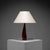 The lamp, designed by ernst henriksen, is defined by its beautifully sculpted teak-wood stand, which tapers elegantly from...