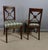 Pair of empire-style mahogany chairs with quiver-shaped backs and gilt bronze mounts. these chairs have been fully...