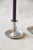 A pair of vintage pewter chambersticks, each with a baluster-turned stem set in a wide, shallow drip pan. Fit them with...
