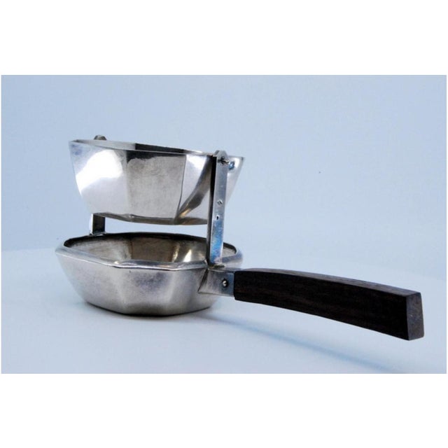 Octagonal Shaped Silver Tea Strainer with Chestnut Wood Handle, in Very Good conditions. Designed before 1890 This piece...