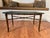Classic in design and eluding to Hollywood Regency style this faux bamboo metal and glass top coffee table might be the...