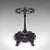 This is an antique reception hall umbrella stand. An English, cast iron six hoop stick rack, dating to the late Victorian...