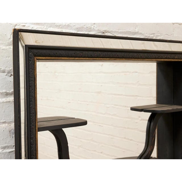 A wonderfully unusual vintage mirror that blurs the line between functional furniture and sculptural wall art. The broad...