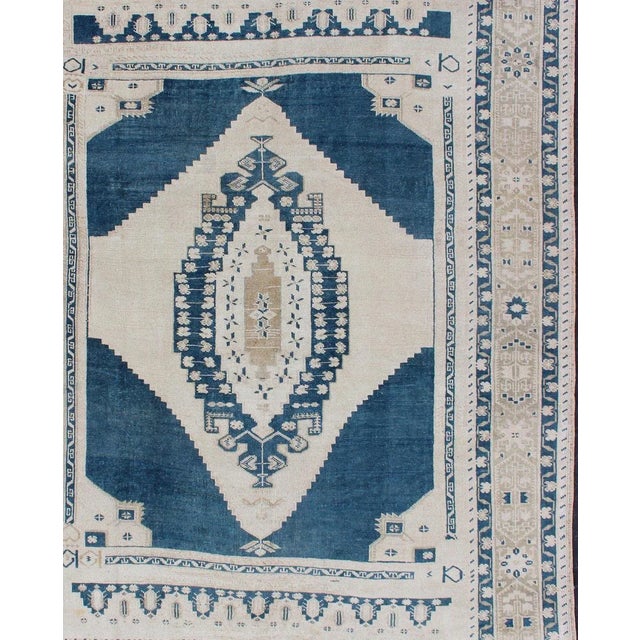 Faded vintage Turkish Oushak rug with Central Medallion in cream and blue, rug tu-mtu-4929, Keivan Woven Arts country of...