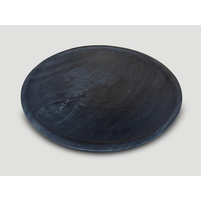 Beautiful oversized wood platter or bowl hand carved from a single piece of suar wood. The backs are flat and can...