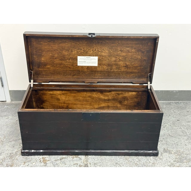 Design Plus Gallery presents the Emmett Coffee Table from Pottery Barn. This trunk-style coffee table has a Zen Brown...