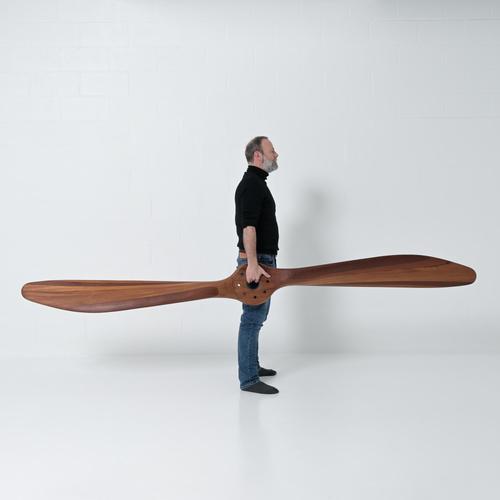 Due to its length and 8 mounting holes, this propeller almost certainly dates before 1918. I haven’t been able to...