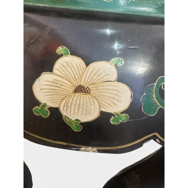 Elegant polychrome cloisonné and black lacquered side table. The petite chinoiserie table has five cabriole legs as...