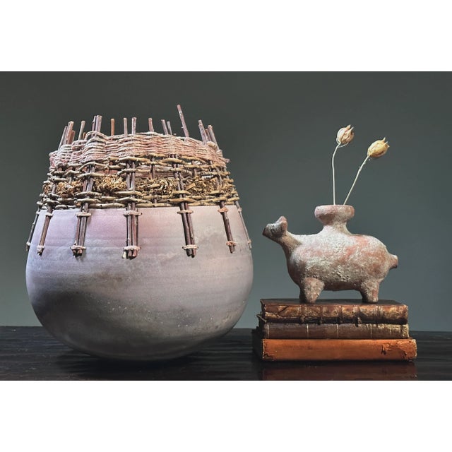 Fiber and Clay Vessel by Christine and Michael Adcock (ca. 1980, Signed). Clay vessel threaded with reeds woven detail...
