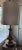 This brass lamp still works and provides a nice lighting to the room. Has a nice light color shade it has a little...