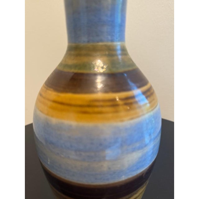 Small decorative vase with multicolor striping. This unique handmade vase is well crafted and looking for a bouquet of...