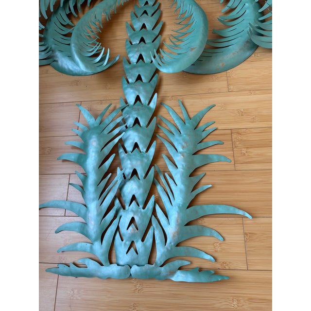 1980 Vintage Metal Palm Trees - A Pair, Made in Thailand. Easy to hang. There is a ring in the back of the metal sculpture