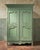 Elegant pistache green painted french provincial marriage armoire, early 19th century. there are pieces of furniture that...