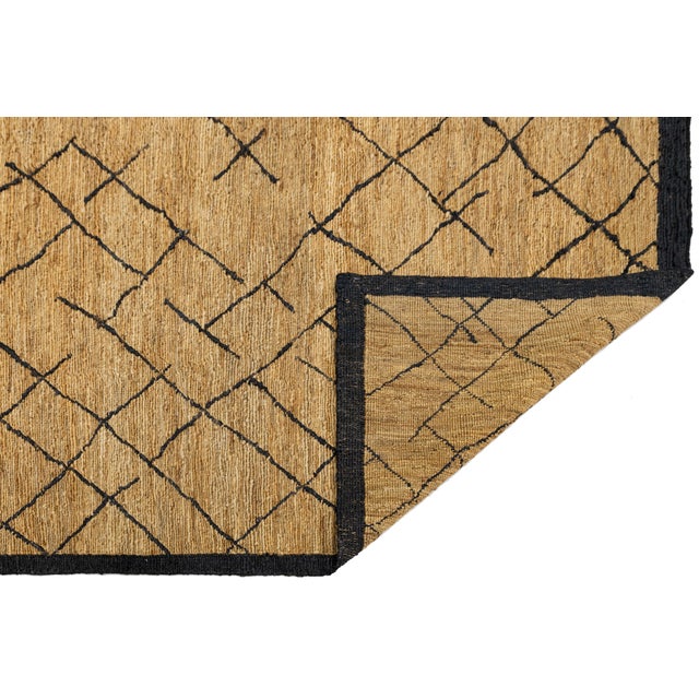 This beautiful modern Soumak hand-knotted Jute rug has a golden-tan field. It features brown accents in a gorgeous all-...