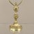 Solid brass base with a polished surface, featuring its original acid-etched frosted glass shade with floral details...