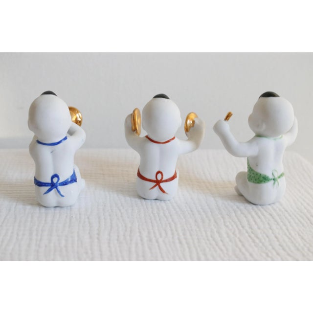 A rare vintage set of bisque porcelain Chinese piano babies. depicting children playing musical instruments. These...