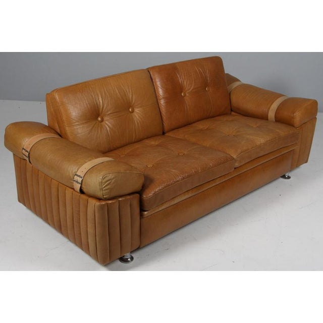 Danish furnituremaker two seat sofa in brutalist style. Made in patinated leather. Based on wheels. Made in Denmark in the...