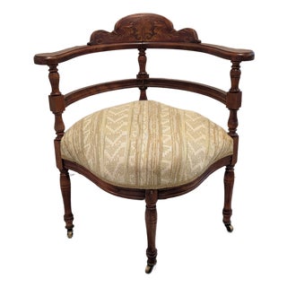 Late 19th Century Victorian Eastlake Accent Chair With Carved Crest and Casters For Sale