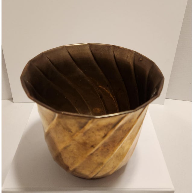 Add a warm, metallic glow to your space with this beautiful vintage solid brass planter/wastecan. Crafted in India during...