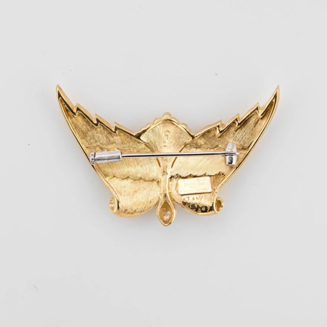 Finely detailed Buccellati "L''air Du Temps" brooch, crafted in 18 karat yellow gold. The textured yellow gold angel wings...