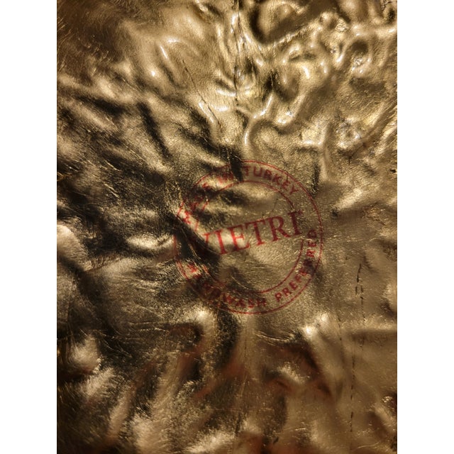 Gold leaf gives this gorgeous bowl shimmer. The molded shape is reminiscent of flower petals.