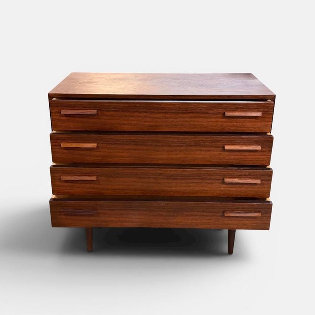 Danish rosewood chest of drawers produced by fm møbelfabrik in denmark during the 1960s. executed in richly grained...