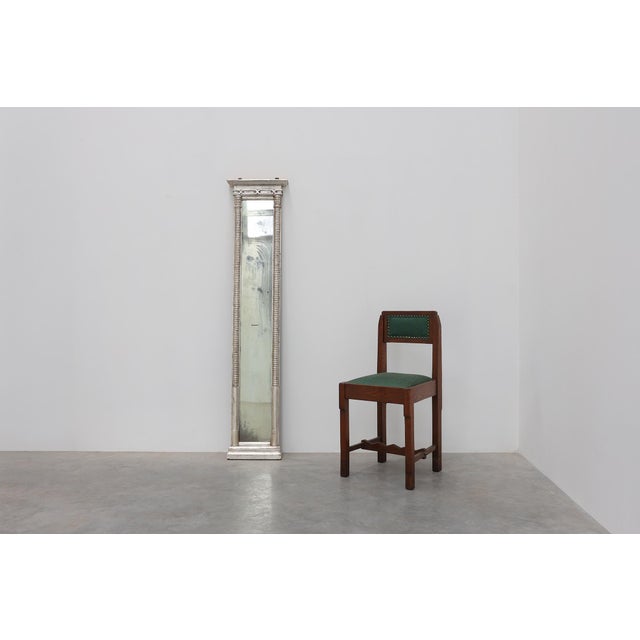 An elegant Italian neoclassical pier mirror dating to the mid-19th century, distinguished by its exceptionally tall and...