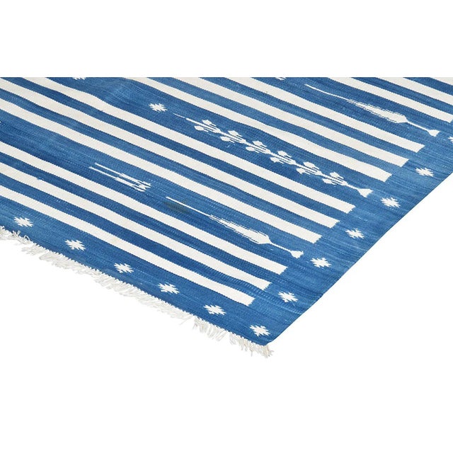 Presenting our Regal Dalia Collection! Made from naturally dyed 100% cotton yarn, these dhurrie rugs have been handwoven...