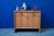 Compact yet with ample storage, this vintage bedside table dates back to the 1950s. The top drawer and the drop-down door...