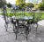 Vintage wrought iron glass top table 4 chairs Table is: 48'' across 29" high Chairs are 50" high on the back and 17" high...