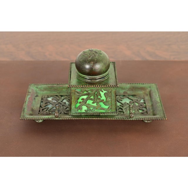 A beautiful Arts & Crafts or Art Nouveau period "Grapevine" pattern bronze and slag glass inkwell with pen holder with...
