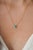This delicate pendant necklace featuring a 0.33 carat pear-shaped emerald, set in 18K yellow gold. The emerald measuring...