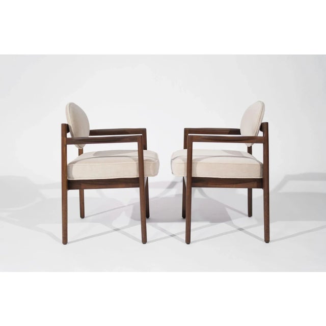 An exquisite pair of mid-century modern armchairs designed by Jens Risom, crafted circa 1960-1969. Meticulously restored,...